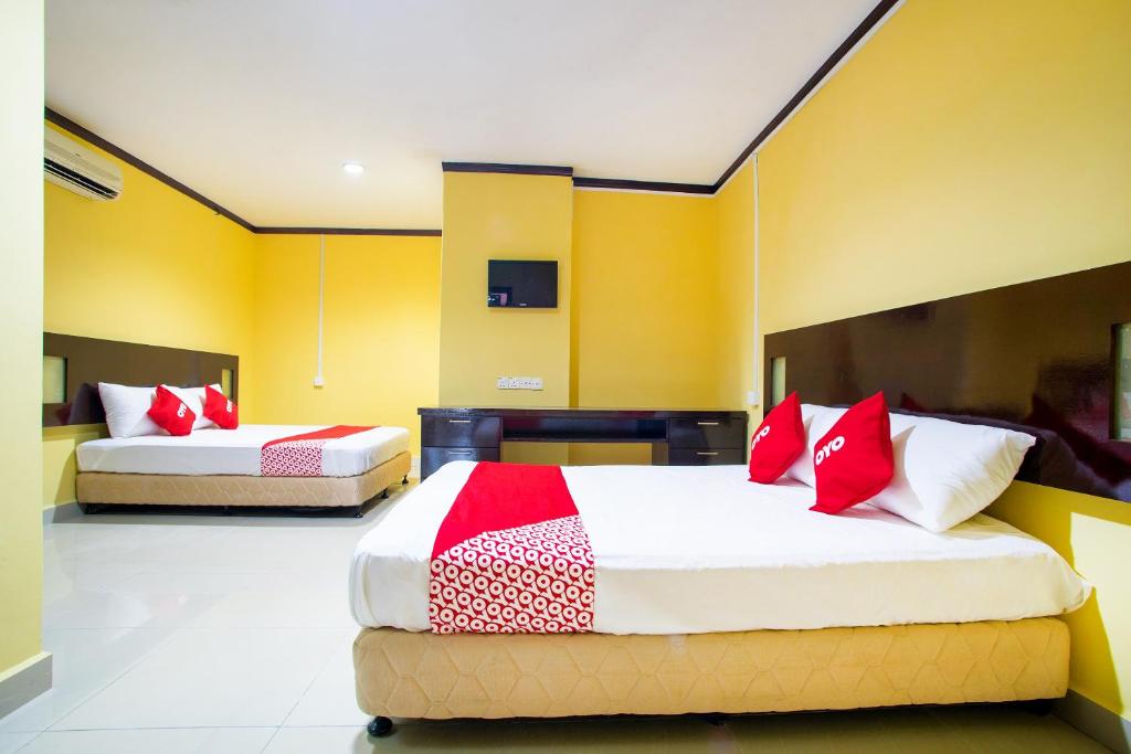Postel nebo postele na pokoji v ubytování Super OYO 1219 Hotel Bbk