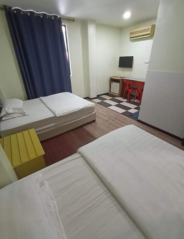 Postel nebo postele na pokoji v ubytování OYO 90809 Oriental Hotel