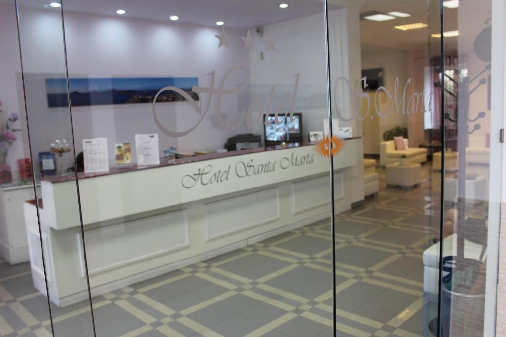 a store window with a sign that reads soft chain cider at Hotel Santa Marta in Pozzuoli