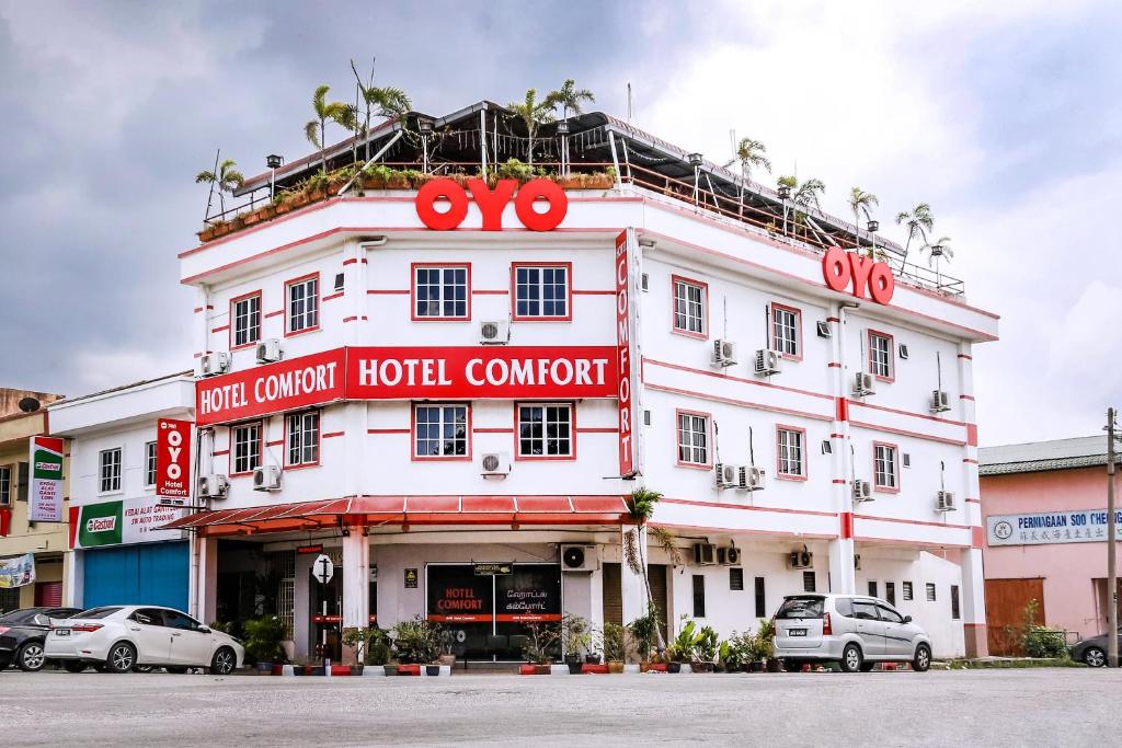 a large white building with a hotel at Hotel O Comfort in Ipoh