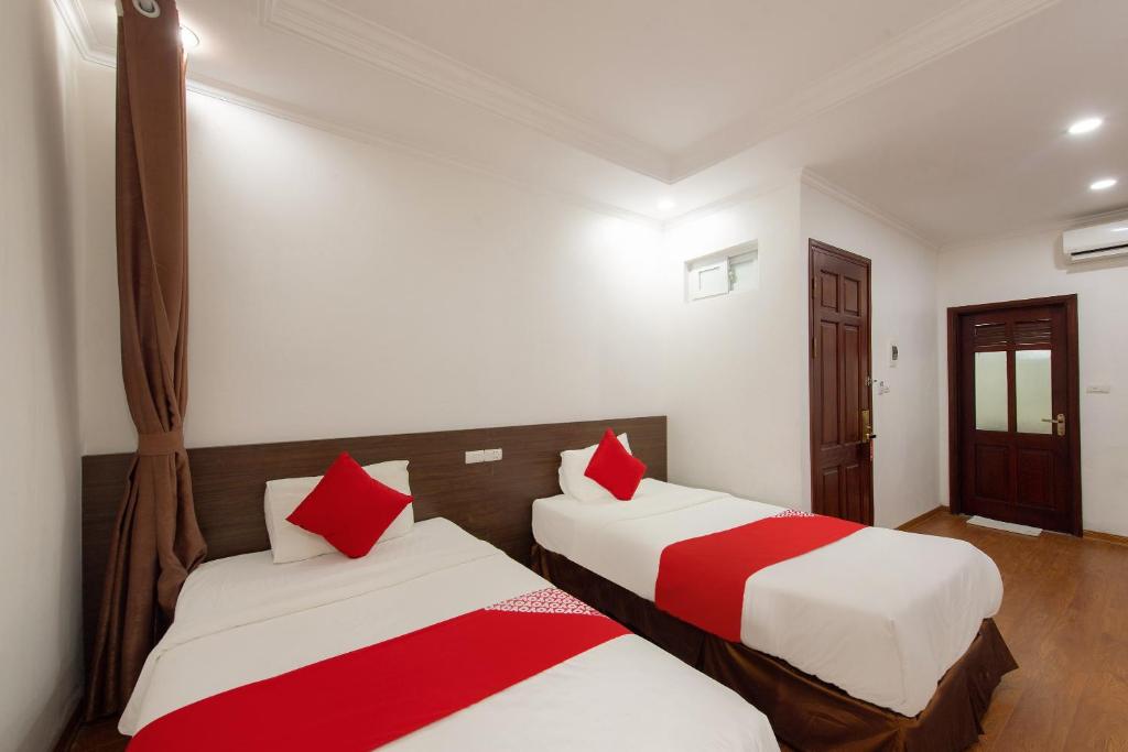 Postel nebo postele na pokoji v ubytování Super OYO Capital O 387 Bach Duong Hotel