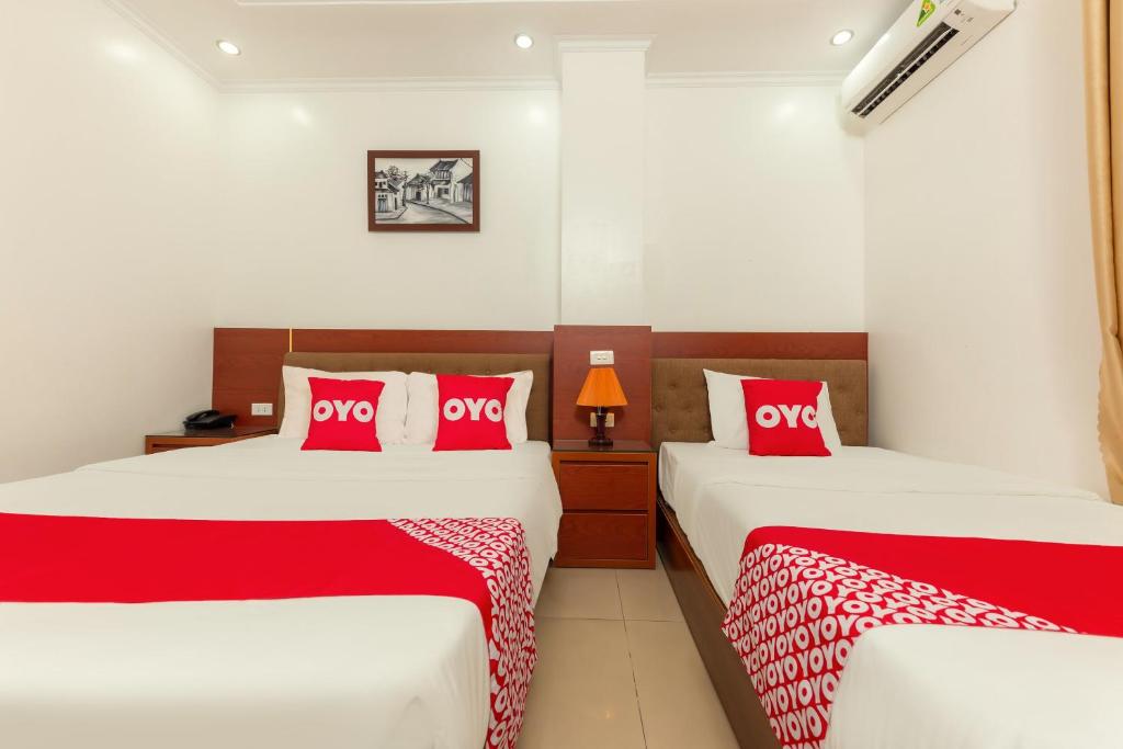 Postel nebo postele na pokoji v ubytování Super OYO Capital O 387 Bach Duong Hotel