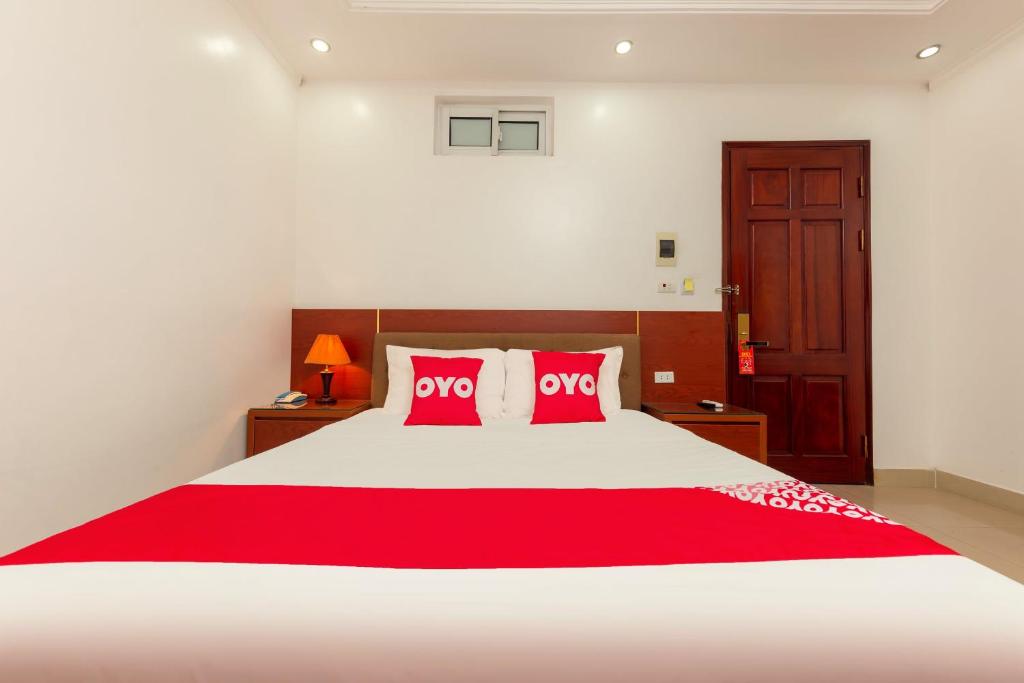 Postel nebo postele na pokoji v ubytování Super OYO Capital O 387 Bach Duong Hotel