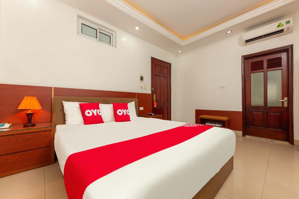 Postel nebo postele na pokoji v ubytování Super OYO Capital O 387 Bach Duong Hotel