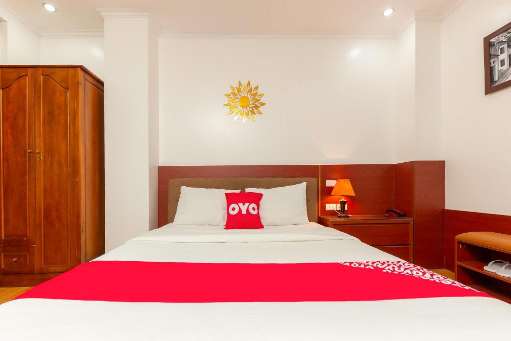 Postel nebo postele na pokoji v ubytování Super OYO Capital O 387 Bach Duong Hotel