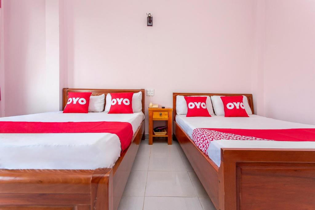 Postel nebo postele na pokoji v ubytování OYO 962 Tulip Motel