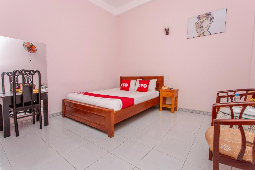 Postel nebo postele na pokoji v ubytování OYO 962 Tulip Motel