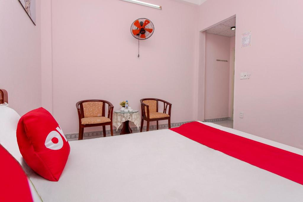 Postel nebo postele na pokoji v ubytování OYO 962 Tulip Motel