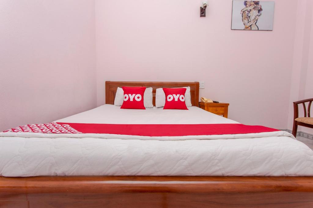 Postel nebo postele na pokoji v ubytování OYO 962 Tulip Motel