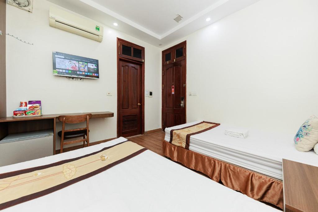Postel nebo postele na pokoji v ubytování OYO 472 Lenka Hotel