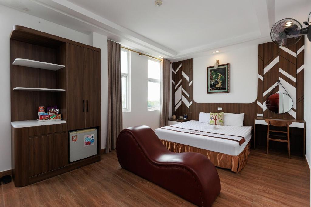 Postel nebo postele na pokoji v ubytování OYO 472 Lenka Hotel