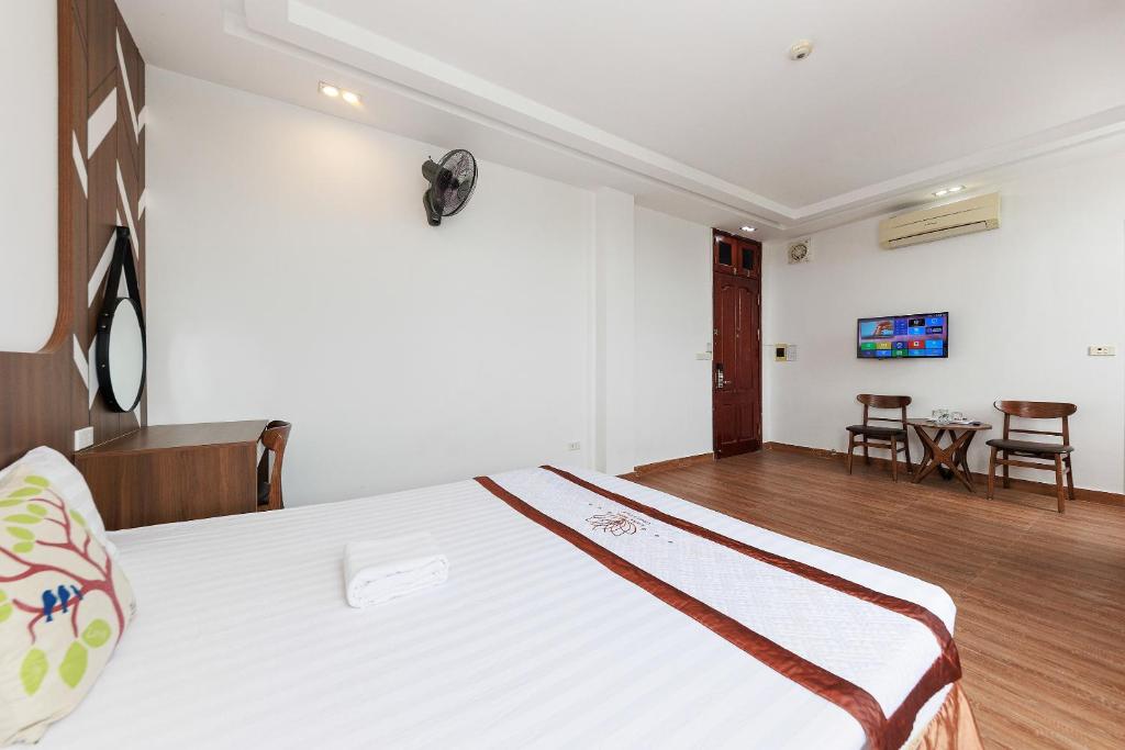 Postel nebo postele na pokoji v ubytování OYO 472 Lenka Hotel