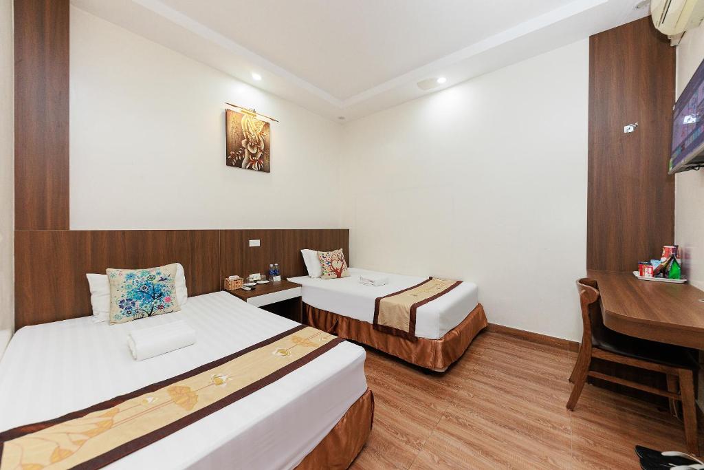 Postel nebo postele na pokoji v ubytování OYO 472 Lenka Hotel