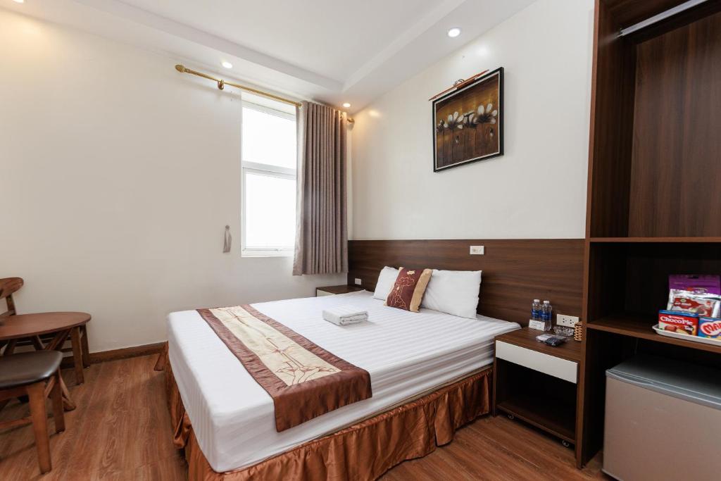 Postel nebo postele na pokoji v ubytování OYO 472 Lenka Hotel