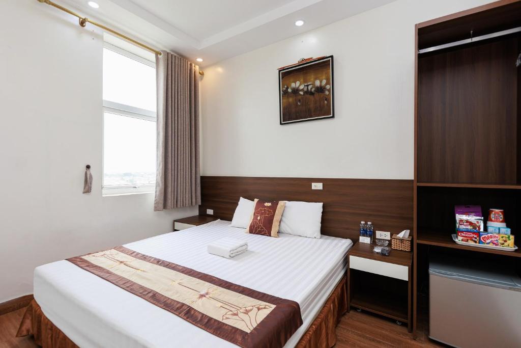 Postel nebo postele na pokoji v ubytování OYO 472 Lenka Hotel