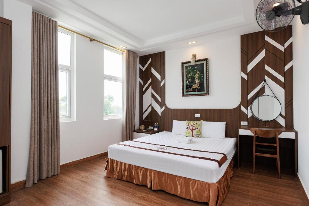 Postel nebo postele na pokoji v ubytování OYO 472 Lenka Hotel