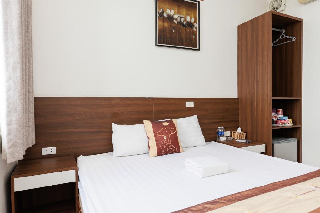 Postel nebo postele na pokoji v ubytování OYO 472 Lenka Hotel
