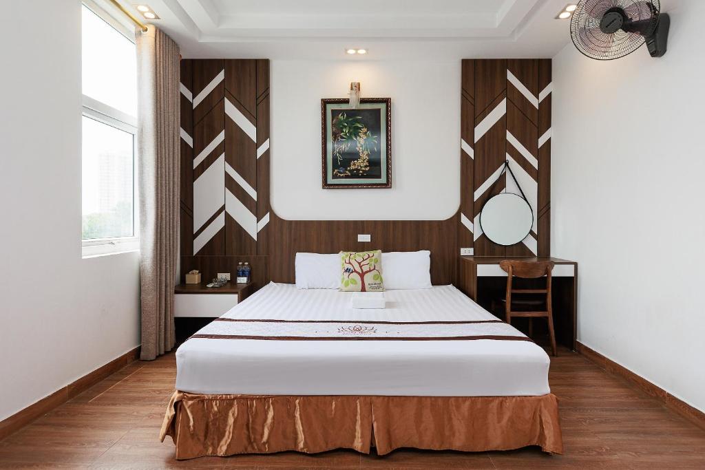 Postel nebo postele na pokoji v ubytování OYO 472 Lenka Hotel