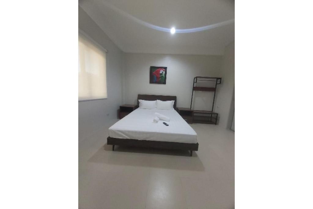 Postel nebo postele na pokoji v ubytování Nest Suites