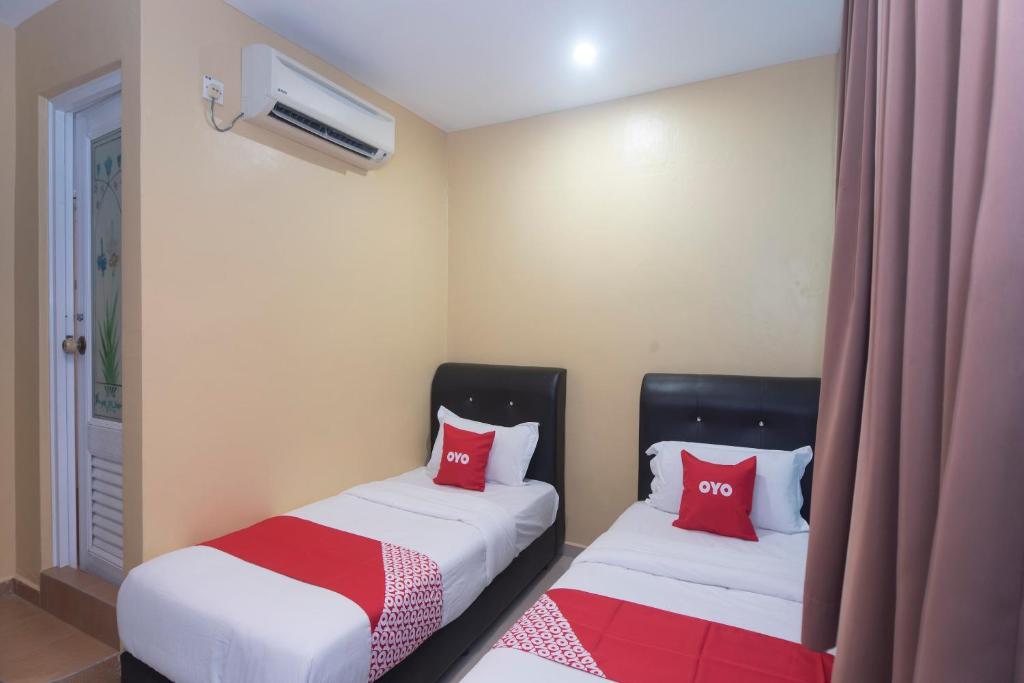 Postel nebo postele na pokoji v ubytování OYO 44016 Rafik Ali Motel