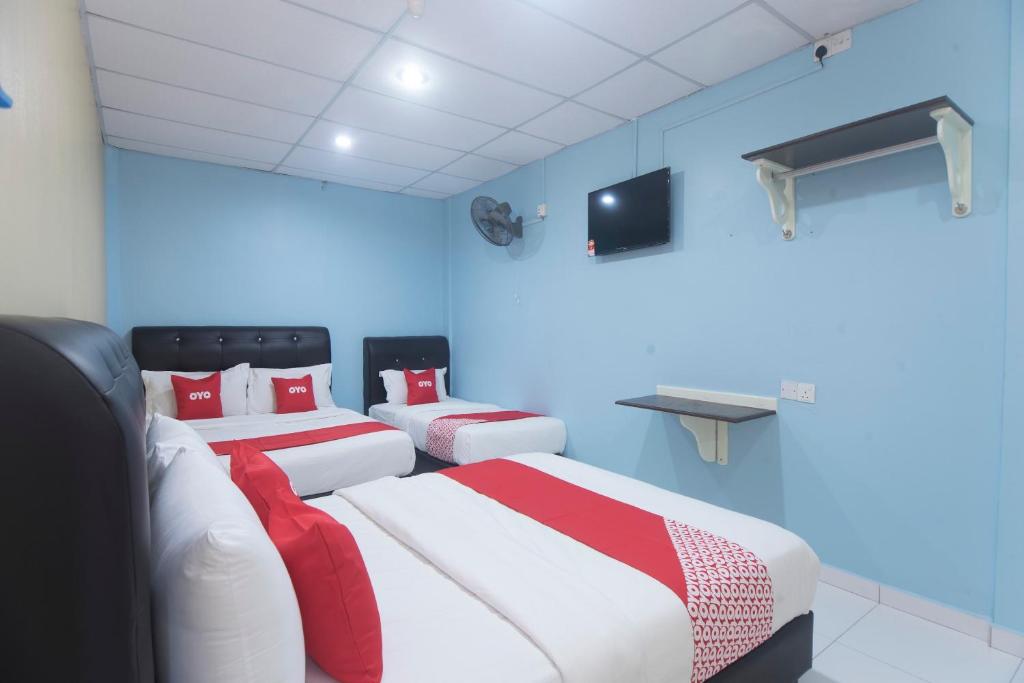 Postel nebo postele na pokoji v ubytování OYO 44016 Rafik Ali Motel
