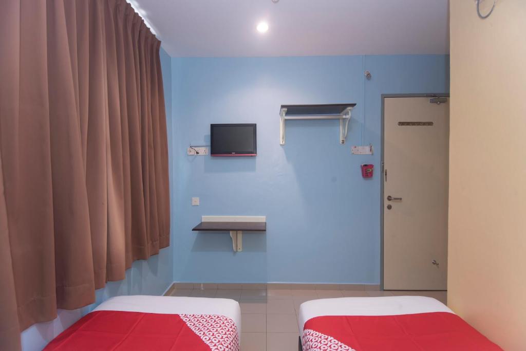 Postel nebo postele na pokoji v ubytování OYO 44016 Rafik Ali Motel