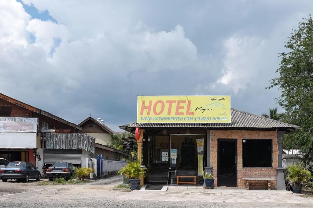 a hotel sign on the front of a building at Hotel O Kay Inn Kerteh in Kertih