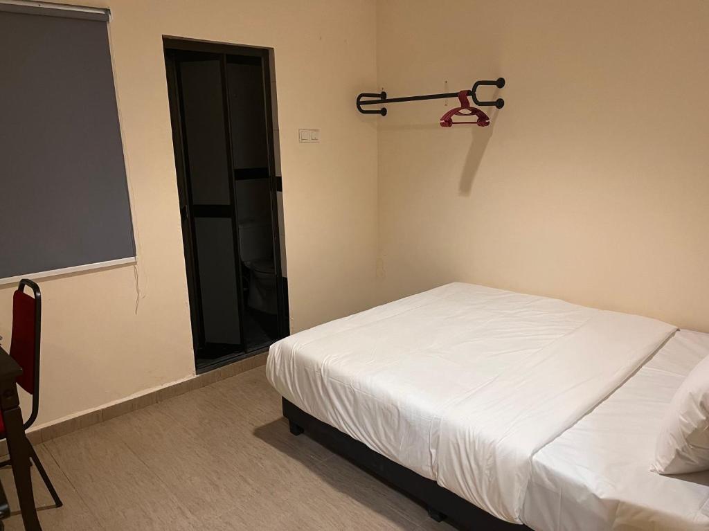 Postel nebo postele na pokoji v ubytování Tampoi Sojourn