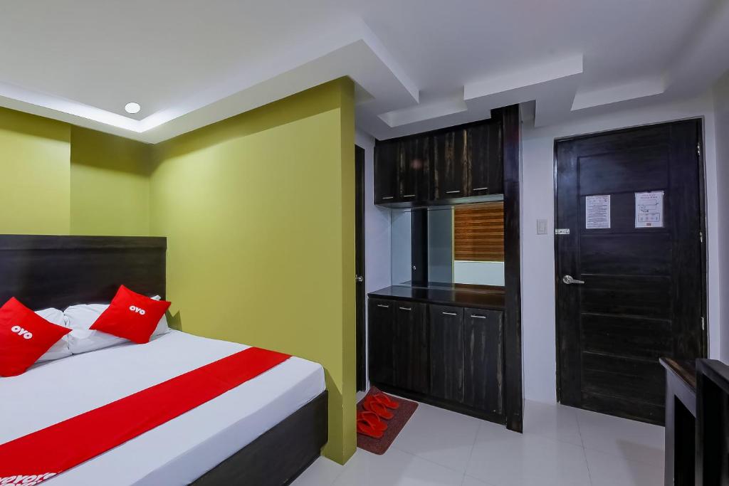 Postel nebo postele na pokoji v ubytování JQV Hotel
