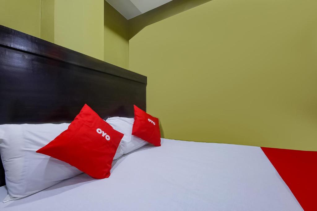 Postel nebo postele na pokoji v ubytování JQV Hotel