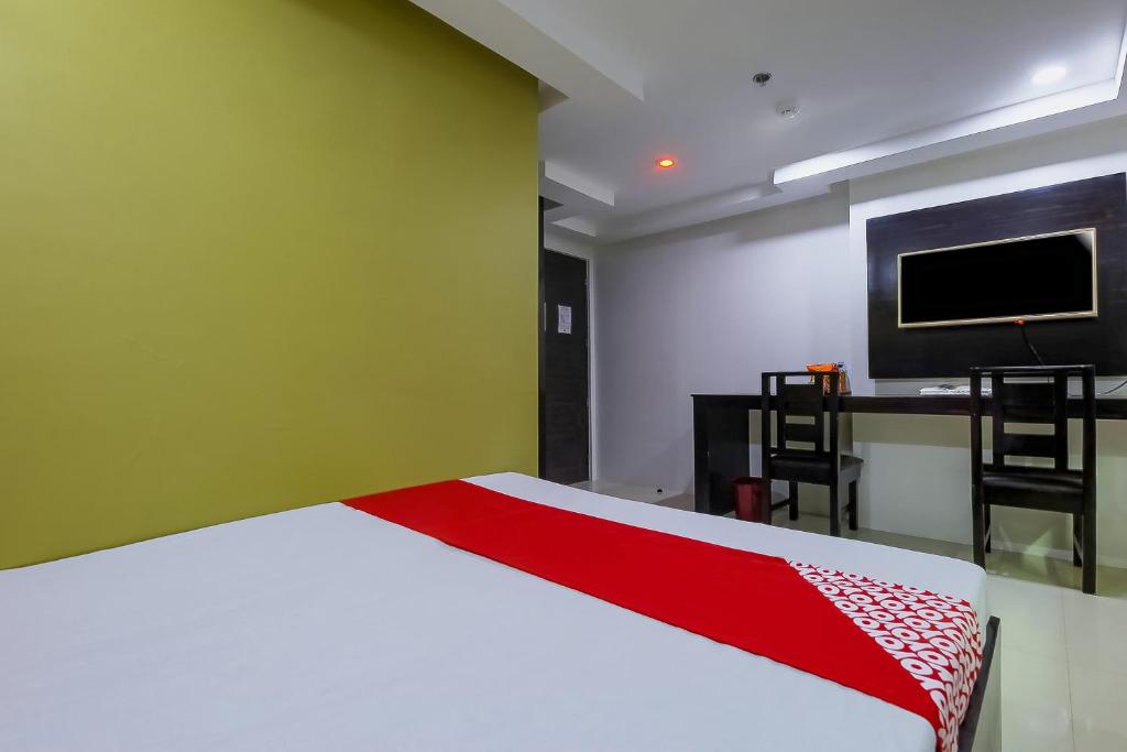 TV a/nebo společenská místnost v ubytování JQV Hotel