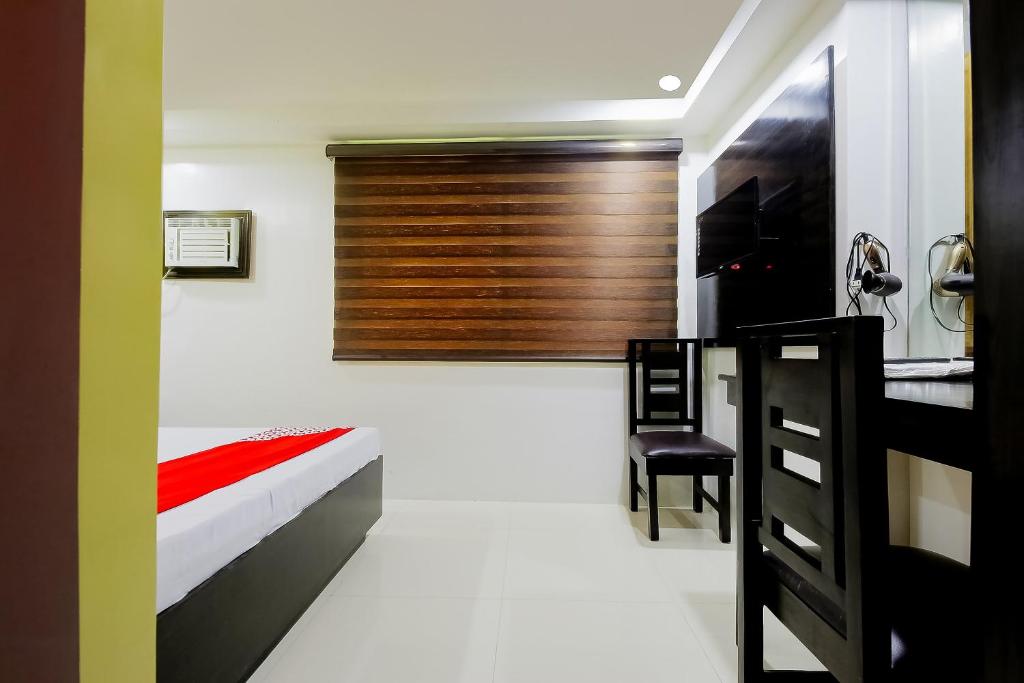 Postel nebo postele na pokoji v ubytování JQV Hotel