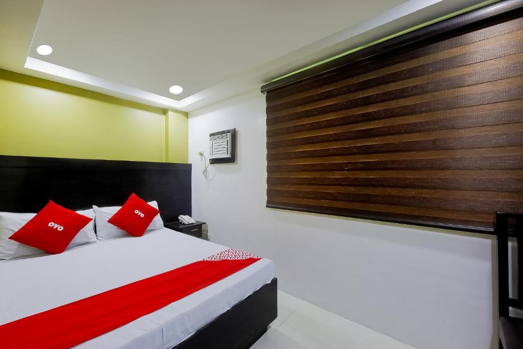 Postel nebo postele na pokoji v ubytování JQV Hotel