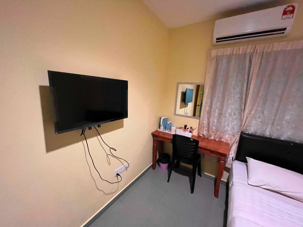 TV a/nebo společenská místnost v ubytování RAHMAH SOJOURN Centre