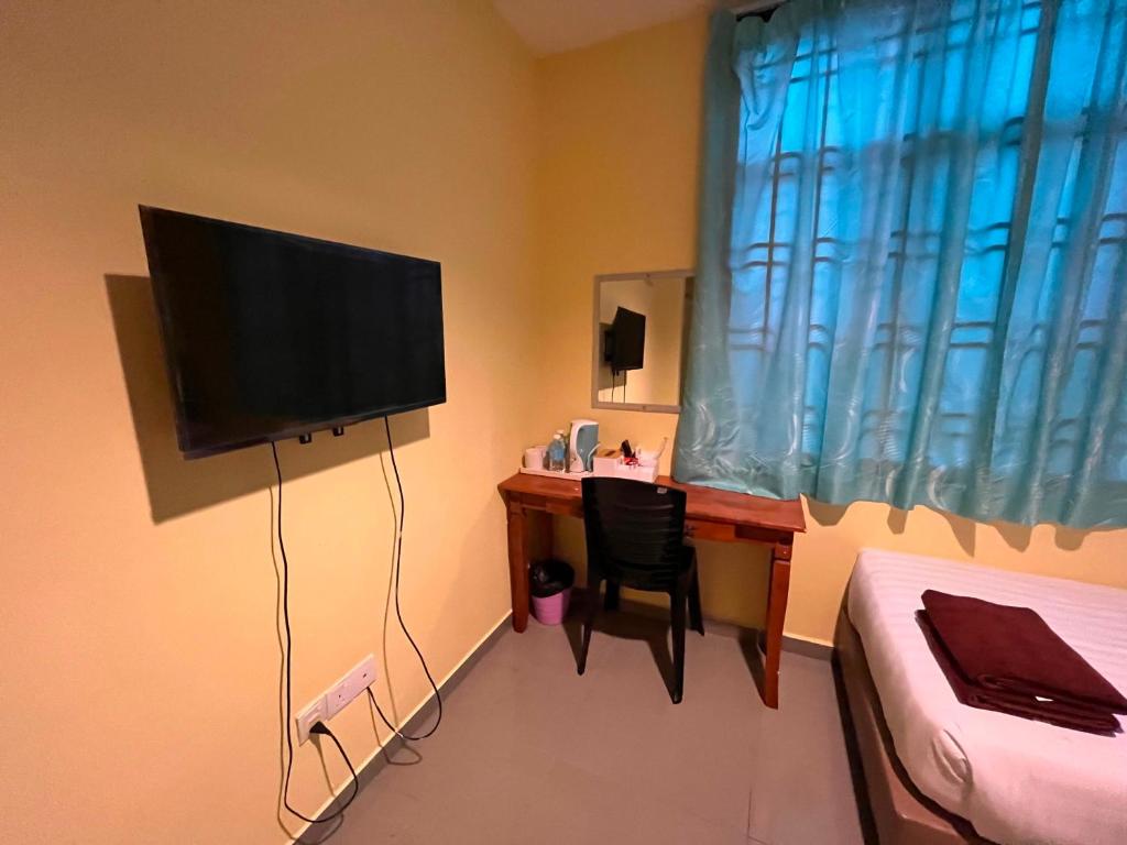 TV a/nebo společenská místnost v ubytování RAHMAH SOJOURN Centre