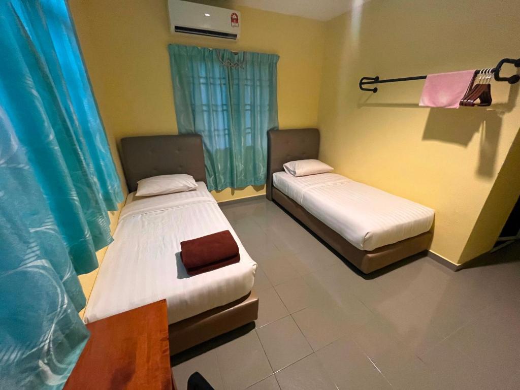 Postel nebo postele na pokoji v ubytování RAHMAH SOJOURN Centre