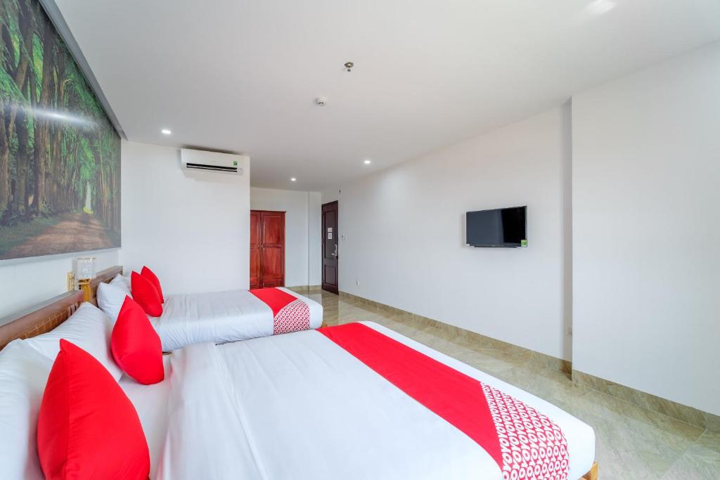 Voodi või voodid majutusasutuse Capital O 215 An Duc Hotel Da Nang toas