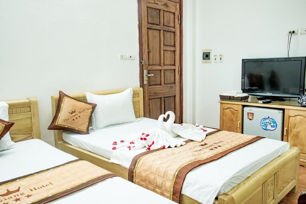 Postel nebo postele na pokoji v ubytování OYO 1143 Thu Giang Hotel