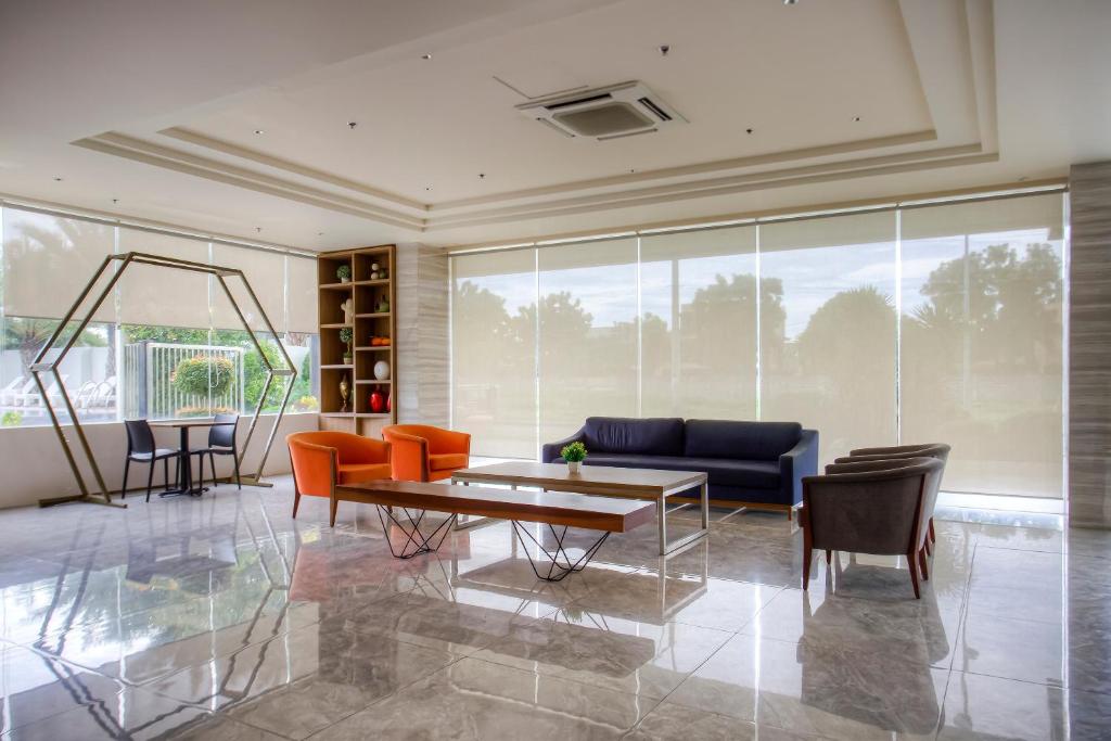 Posezení v ubytování Capital O 827 Speciale Hotel