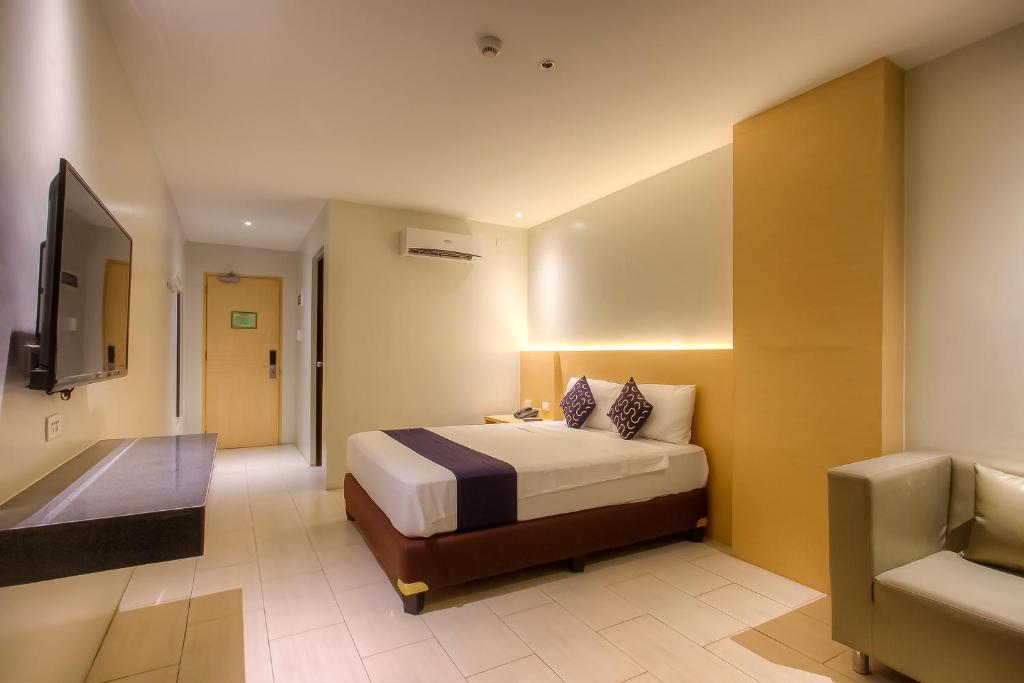 Postel nebo postele na pokoji v ubytování Capital O 827 Speciale Hotel
