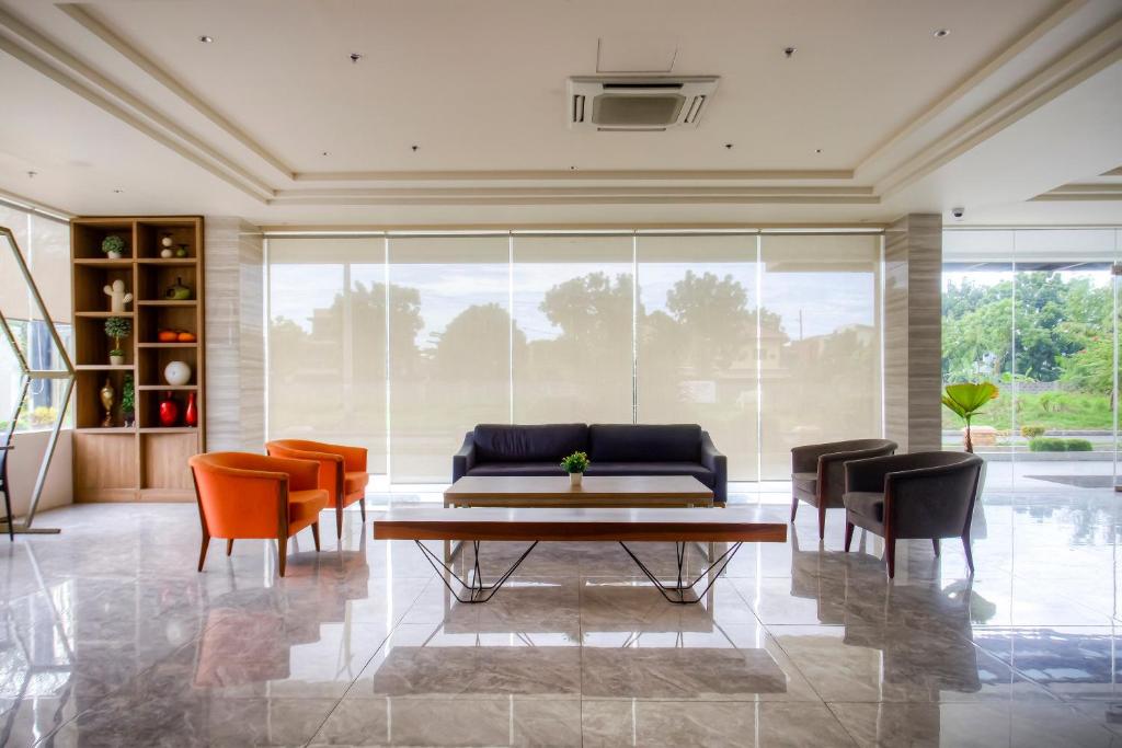 Posezení v ubytování Capital O 827 Speciale Hotel