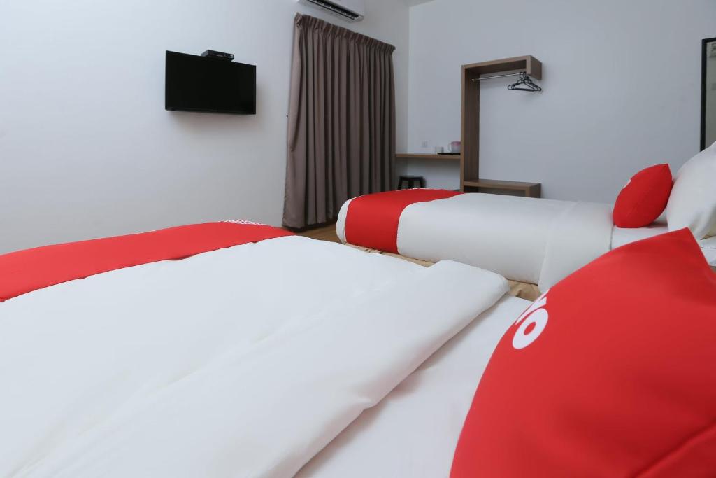 Postel nebo postele na pokoji v ubytování OYO 89915 East Mount Hotel