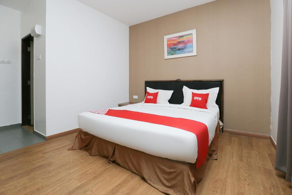 Postel nebo postele na pokoji v ubytování OYO 89915 East Mount Hotel