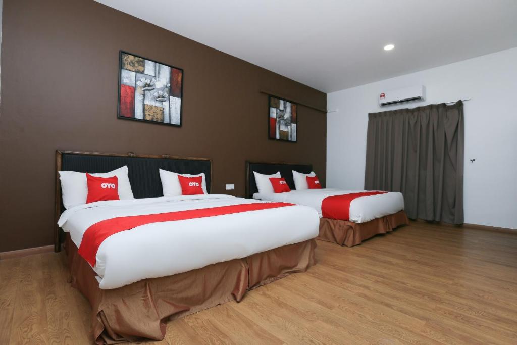 Postel nebo postele na pokoji v ubytování OYO 89915 East Mount Hotel