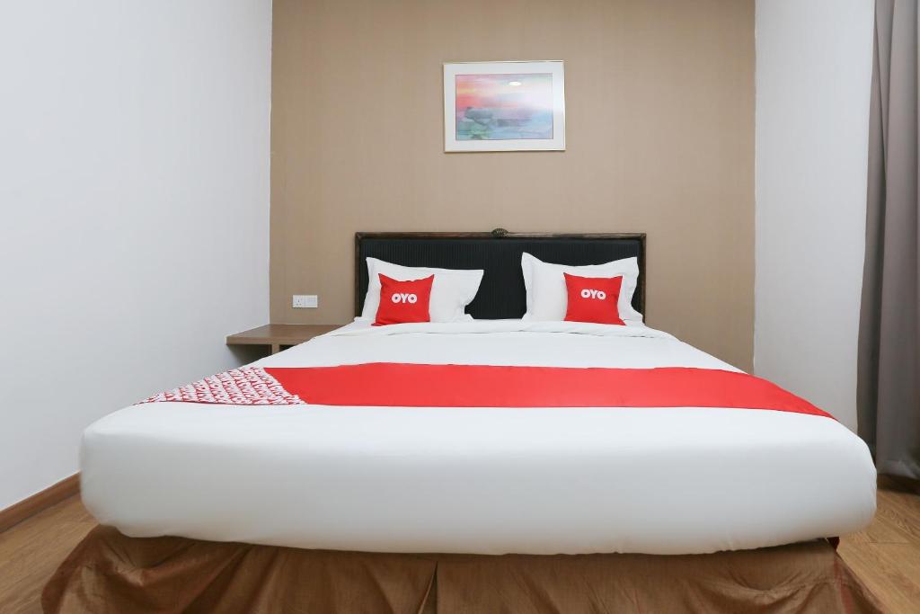 Postel nebo postele na pokoji v ubytování OYO 89915 East Mount Hotel
