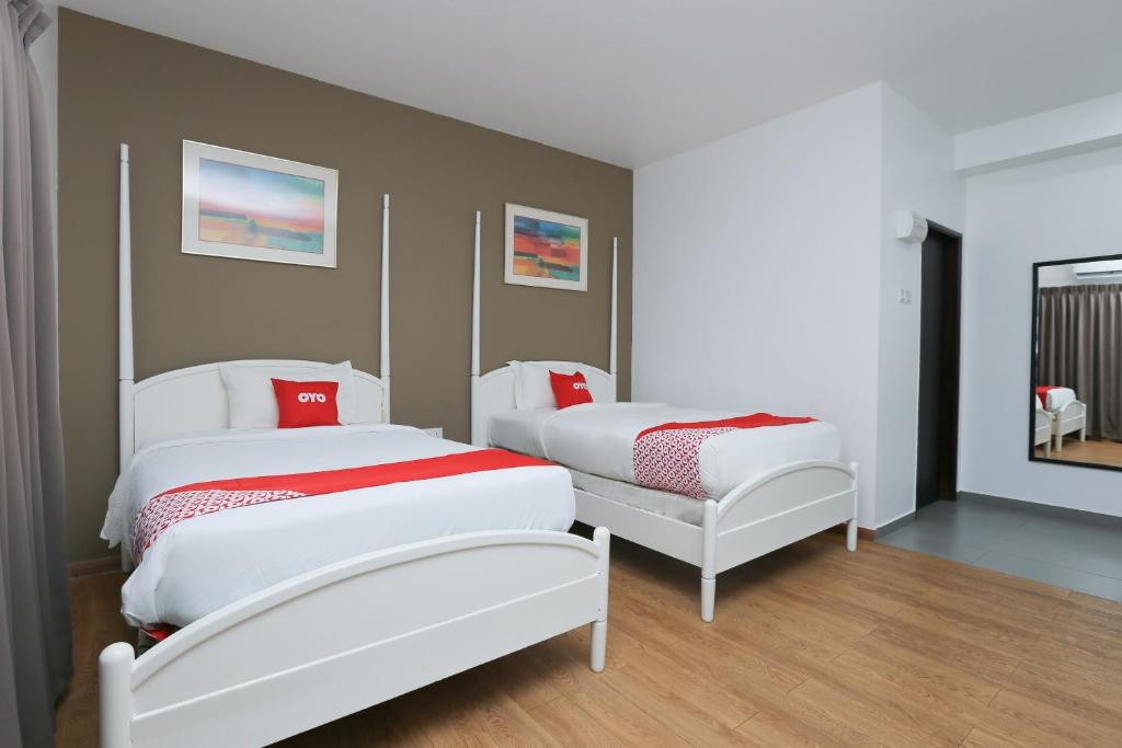 Postel nebo postele na pokoji v ubytování OYO 89915 East Mount Hotel