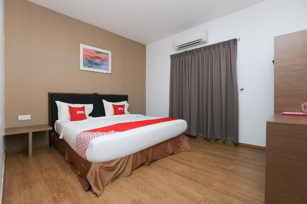 Postel nebo postele na pokoji v ubytování OYO 89915 East Mount Hotel