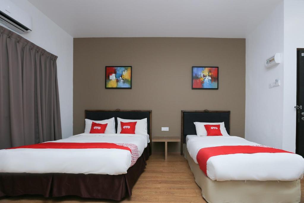 Postel nebo postele na pokoji v ubytování OYO 89915 East Mount Hotel