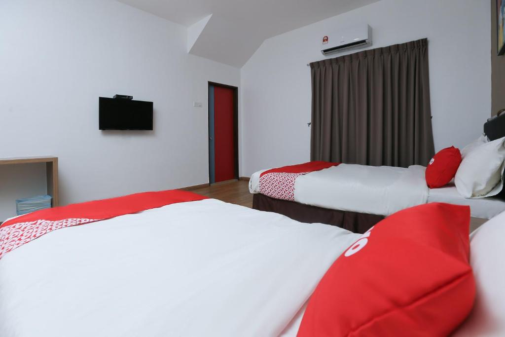 Postel nebo postele na pokoji v ubytování OYO 89915 East Mount Hotel