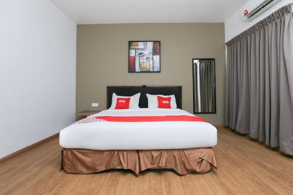 Postel nebo postele na pokoji v ubytování OYO 89915 East Mount Hotel